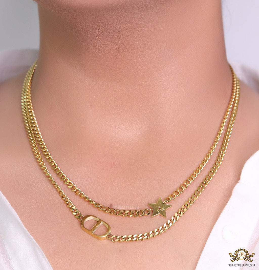 Dual chain necklace with alphabet and star motif