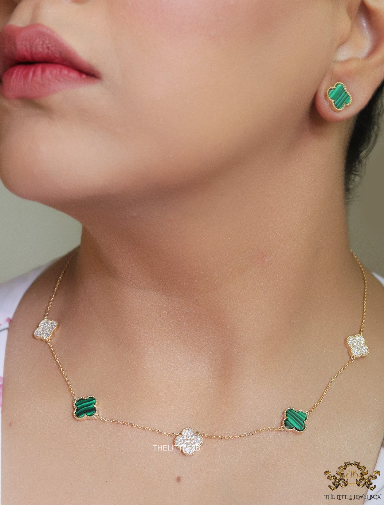 Gold plated necklace set with cz and malachite green clovers