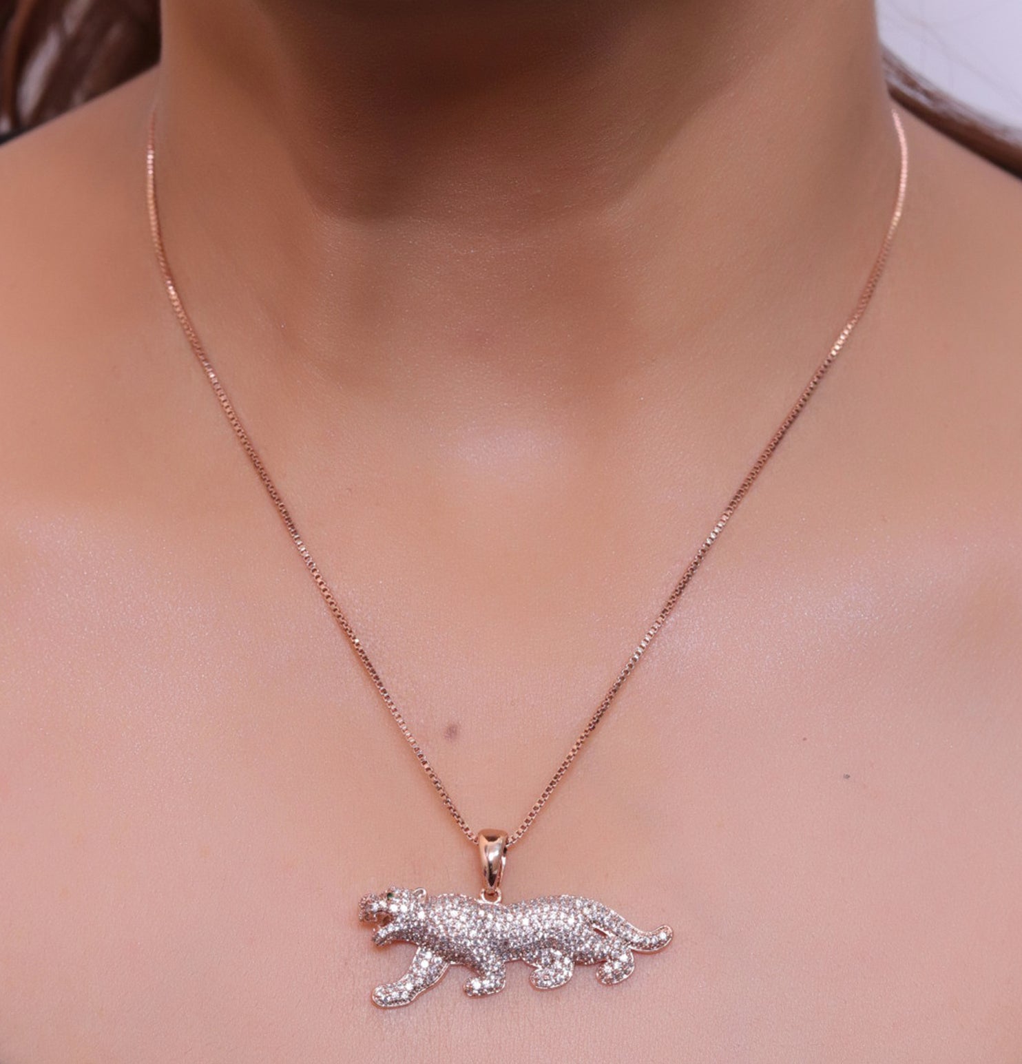 Rose Gold plated cubic zirconia panther pendant on sleek platinum plated chain