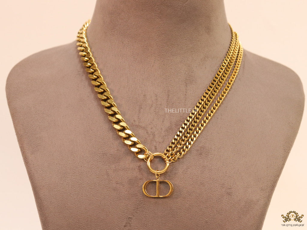 Multiple golden chain necklace with alphabet pendant