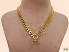 Multiple golden chain necklace with alphabet pendant