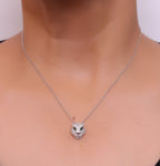 Platinum plated cubic zirconia stones panther face motif pendant with emerald green stones details on sleek Platinum plated chain