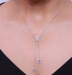 Emerald cut cubic zirconia stones in different sized on sleek platinum plated chain