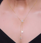 Emerald cut cubic zirconia stones in different sized on sleek gold plated chain
