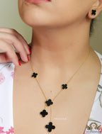 Gold plated necklace set with black enamel coated clovers