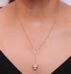 Gold plated sleek chain with circular cubic zirconia disk and gold plated panther face motif pendant