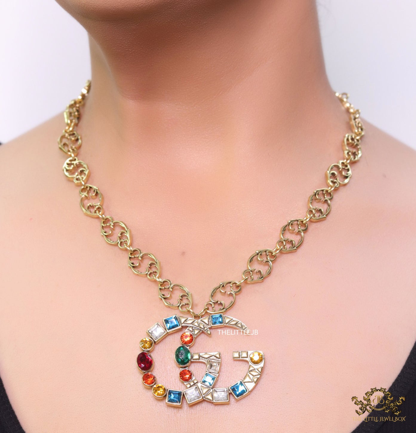 Golden fancy link chain necklace with multi cz twin G pendant