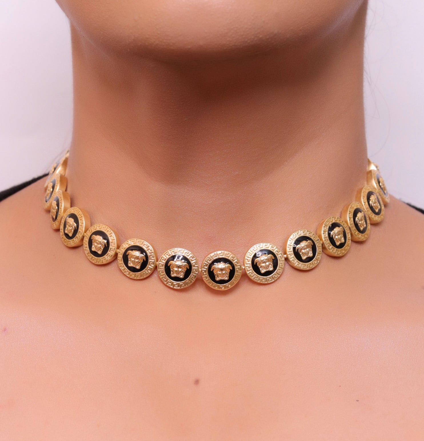 Gold plated Medusa motif on black circles necklace