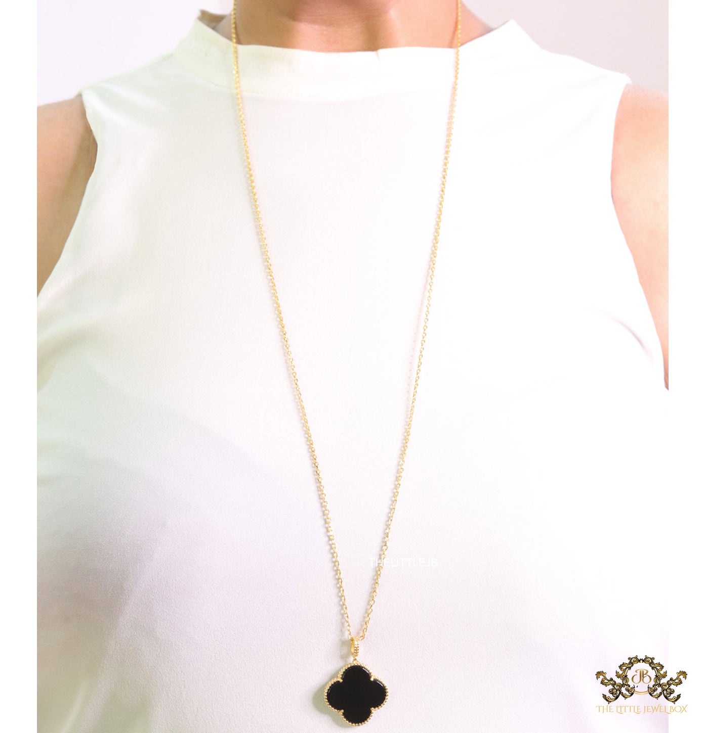 Black enamel clover pendant in gold plated chain
