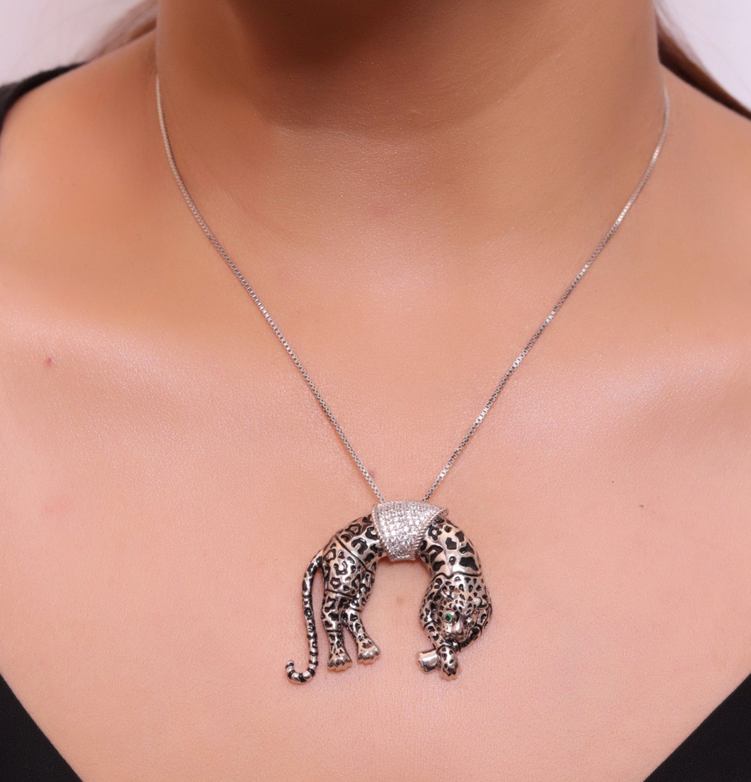 Platinum plated resting leopard pendant with cubic zirconia and Platinum chain