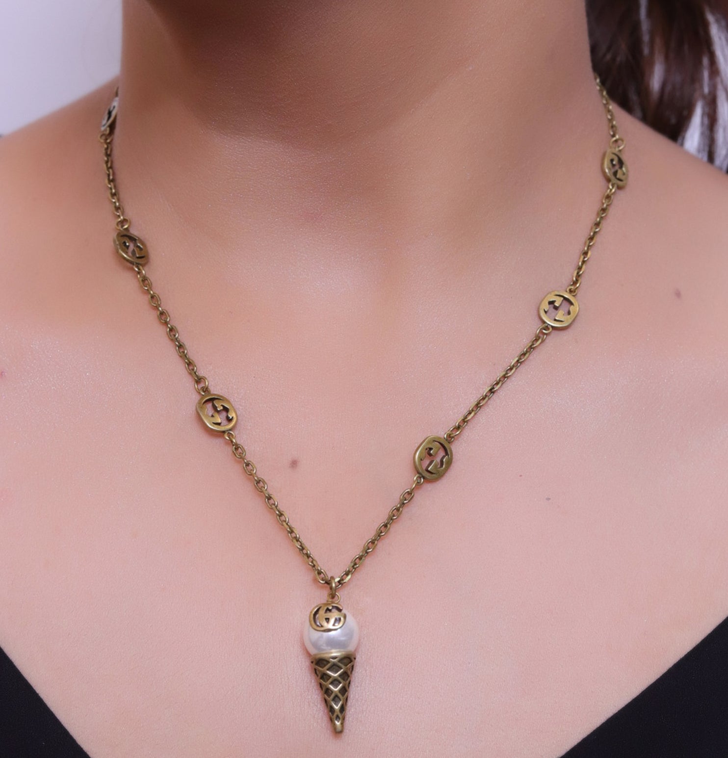 Antique gold plated alphabet motif chain with golden cone pendant