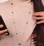 Golden chain necklace with malachite green clovers