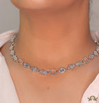 Choker style necklace with charms in platinum finish