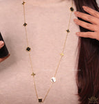 Golden chain necklace with black enamel clovers