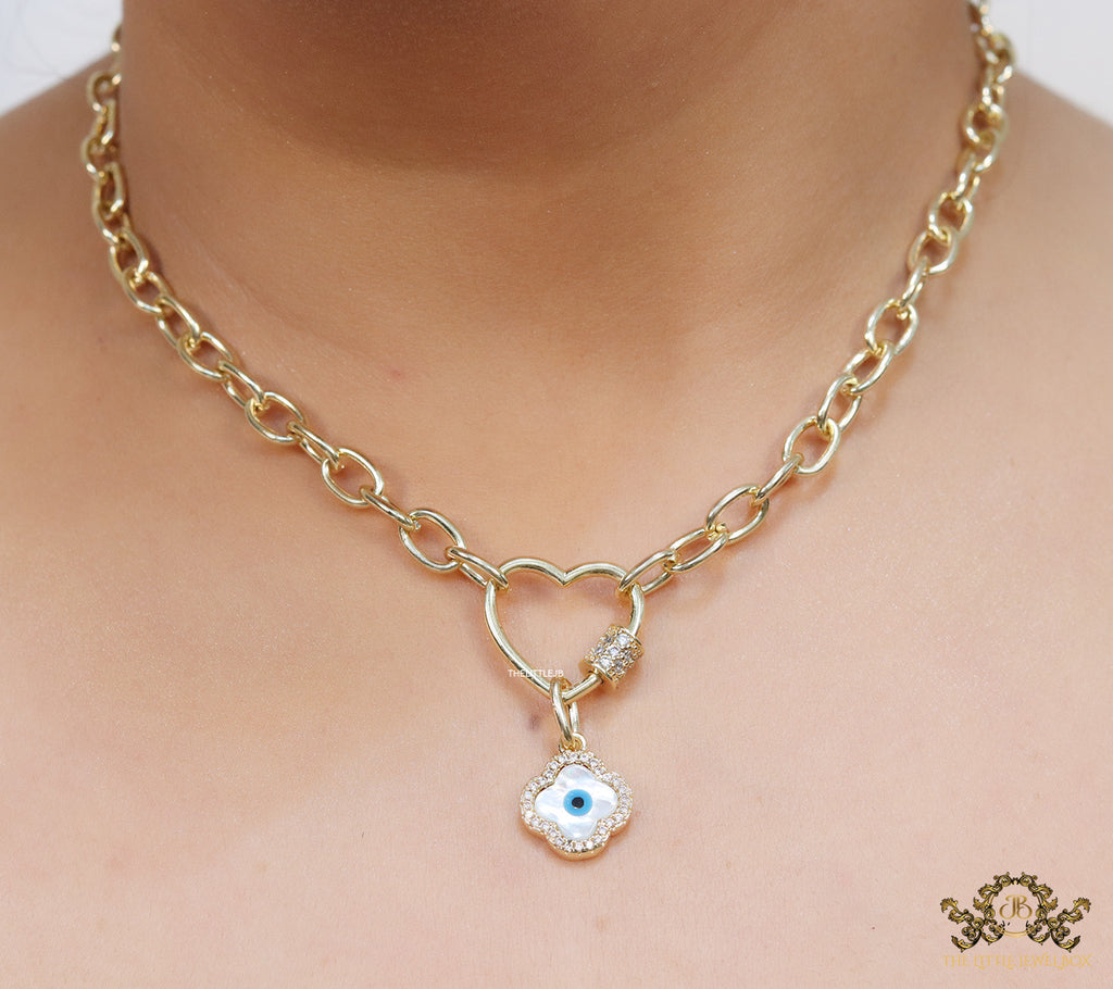 Gold plated link chain necklace with heart shaped lock and evil eye clover pendant