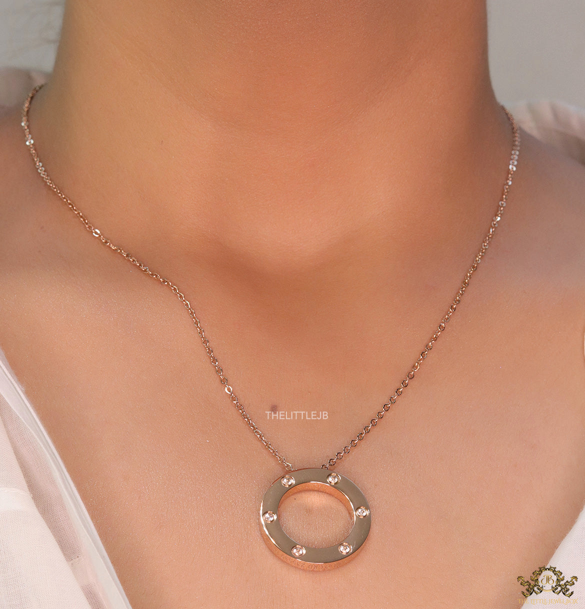 Rose gold plated disc shape pendant necklace with cz