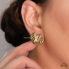 Gold plated stud earrings with alphabet motifs