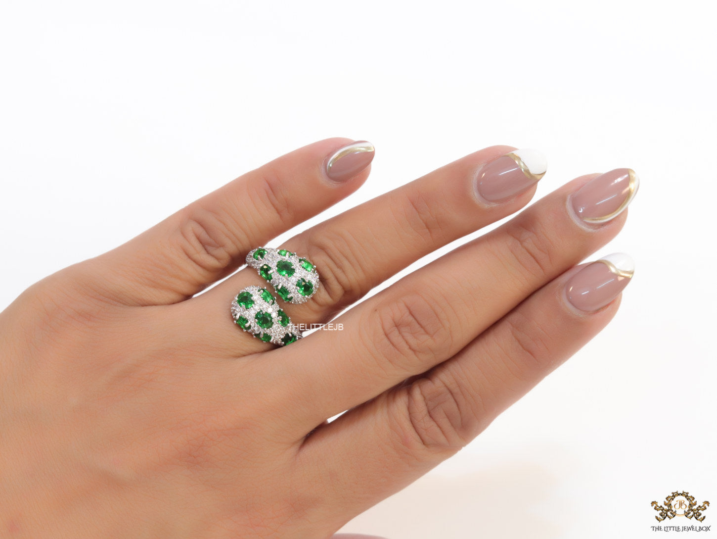Top open platinum plated white and green cz ring