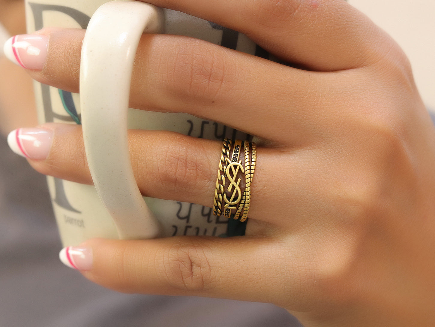 Multilayered open golden ring with alphabet initial