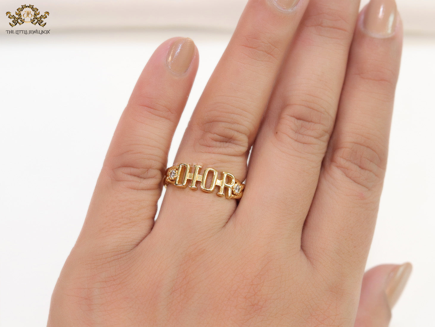 Gold plated alphabet open ring with white cz