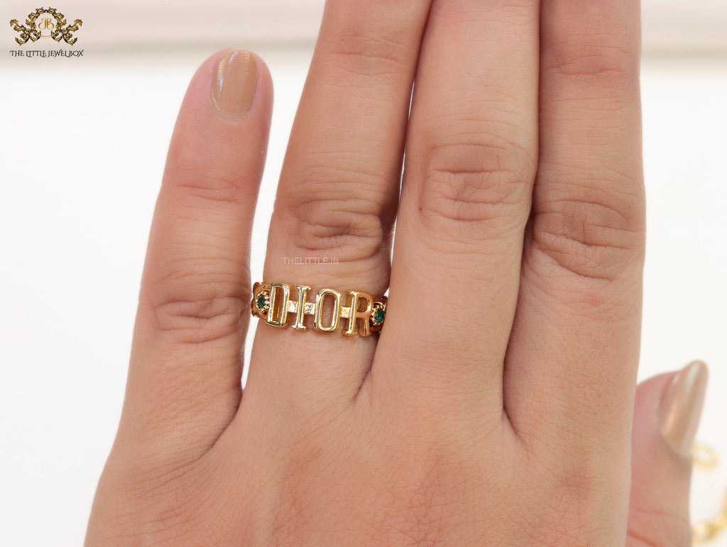 Gold plated alphabet open ring with green cz