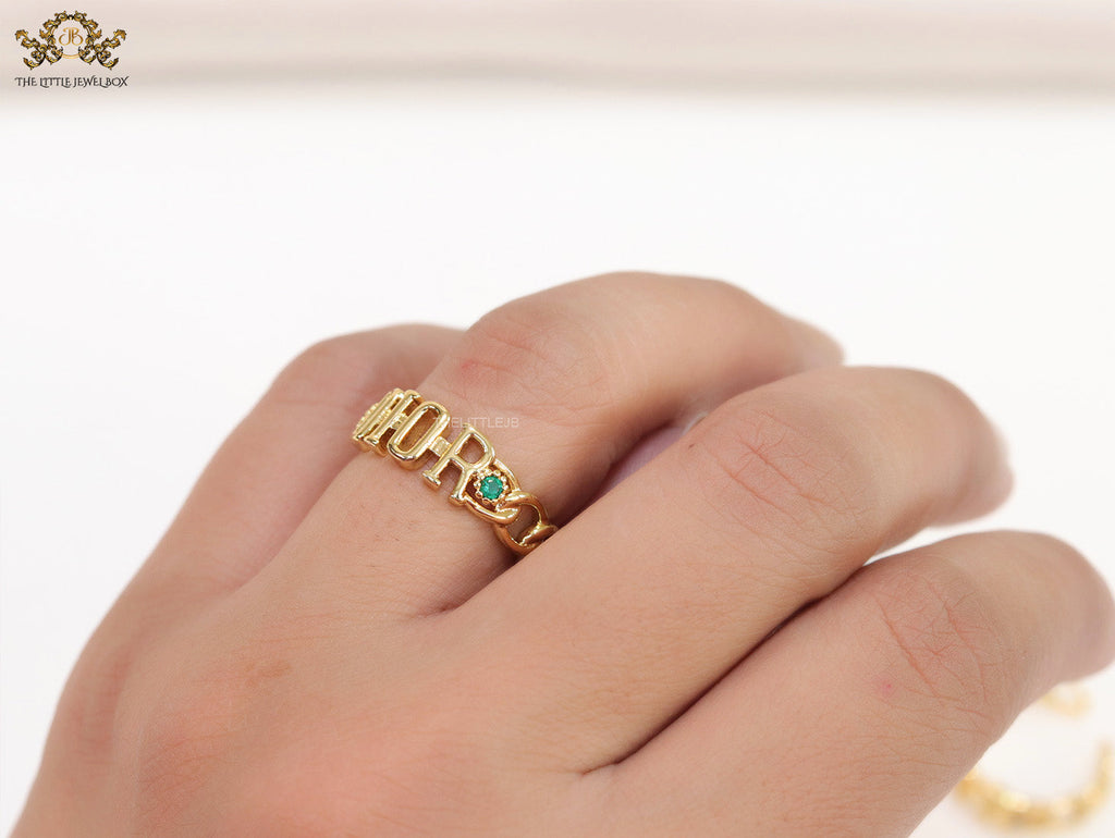 Gold plated alphabet open ring with green cz