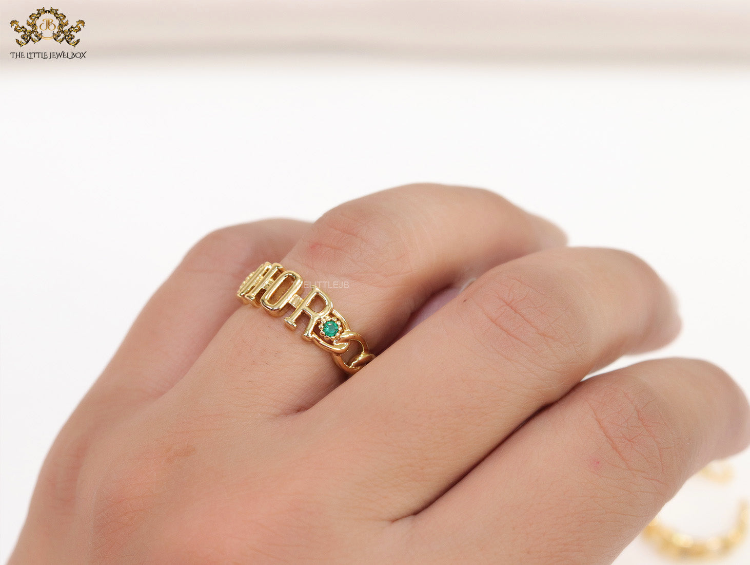 Gold plated alphabet open ring with green cz