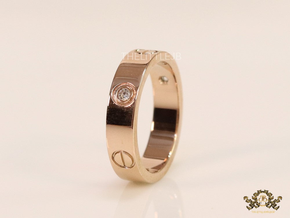 Narrow 4.5mm rose gold band with screws and stones