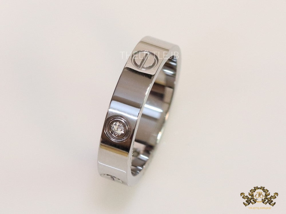 Narrow 4.5mm platinum plated band with screws and stones