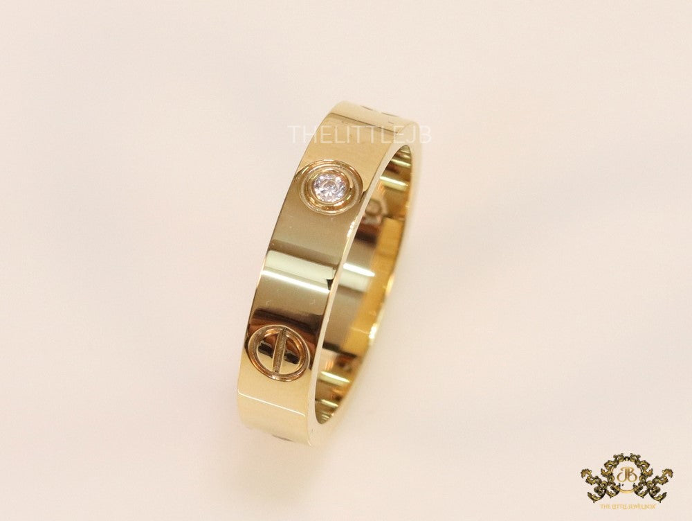 Narrow 4.5mm gold band with screws and stones