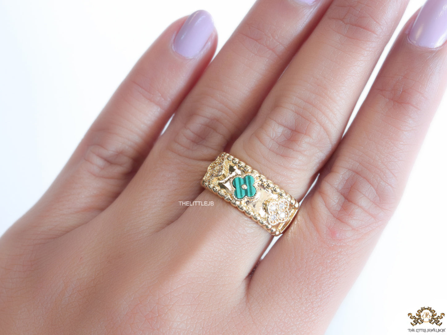 Golden ring band with malachite green and cz clovers