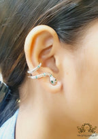 Platinum plated ear cuff pattern serpentine earrings with green cz